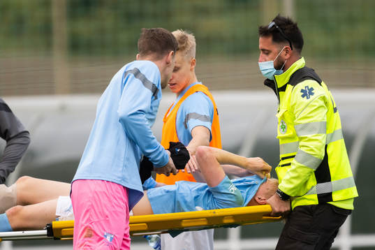Goalkeeper Johan Dahlin and injured Emil Lindman