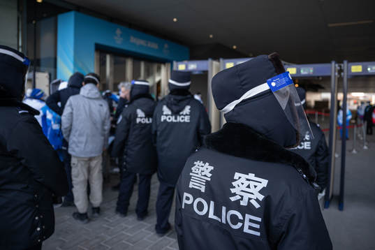 Police officers at a security check outside of Main Media