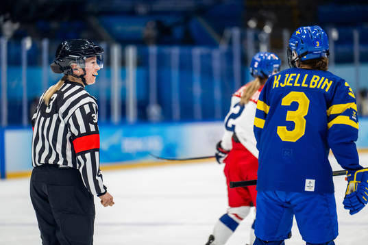 Referee Cianna Lieffers talks to Anna Kjellbin of Sweden in