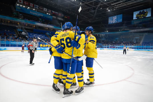 The Swedish players celebrate