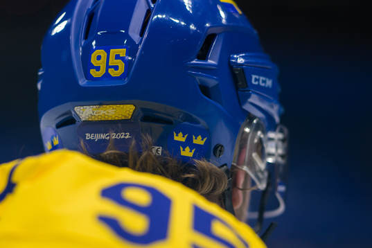 A Beijing 2022 sign at the helmet of Jacob de la Rose of