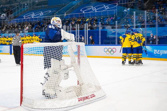goaltender Jussi Olkinoura of Finland looks dejected while