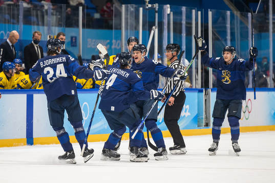 Harri Pesonen of Finland celebrates with team mates