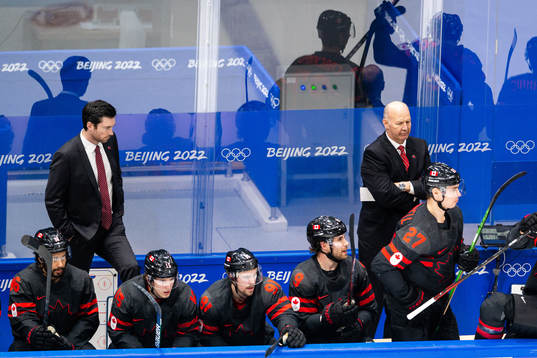 Assistant coach Jeremy Colliton and head coach Claude