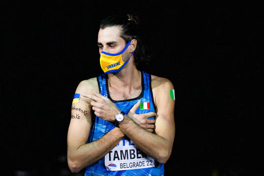 Gianmarco Tamberi of Italy points to the Ukrainan flag and