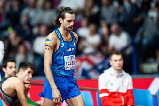 Gianmarco Tamberi of Italy with the Ukrainan flag and the