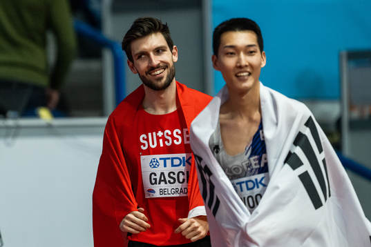 Loic Gasch of Switzerland and Sanghyeok Woo of South Korea