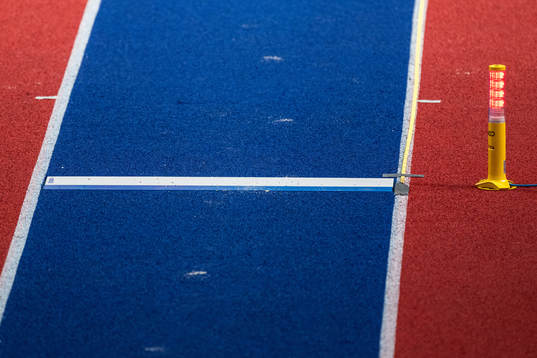 The take-off board with a light in red that signals a foul