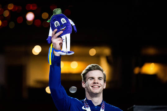 Christopher Nilsen of USA (bronze) celebrates