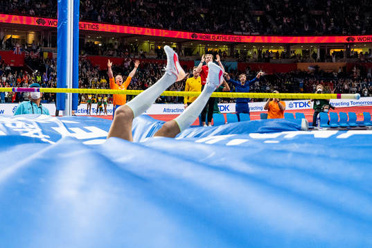 Fellow athletes celebrate as Armand Duplantis of Sweden