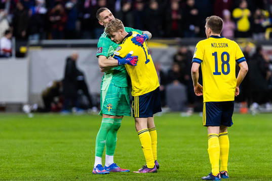 Filip Helander and goalkeeper Robin Olsen of Sweden