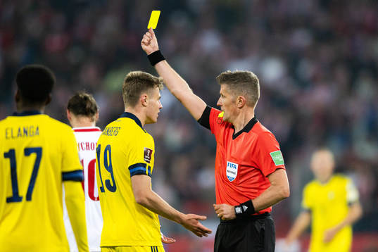 Mattias Svanberg of Sweden and referee Daniele Orsato
