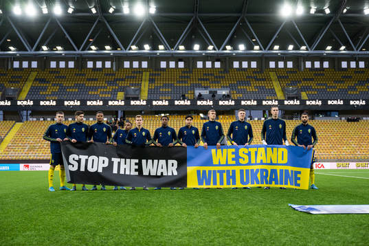 Players of Sweden participate in a manifestation against