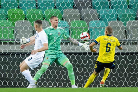 Sandi Lovric of Slovenia against goalkeeper Robin Olsen and