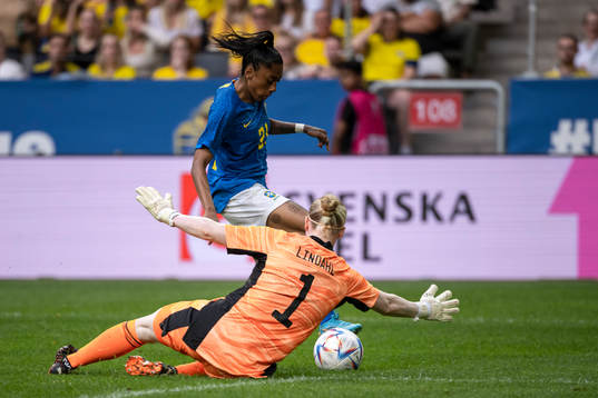 Kerolin of Brazil and goalkeeper Hedvig Lindahl of Sweden