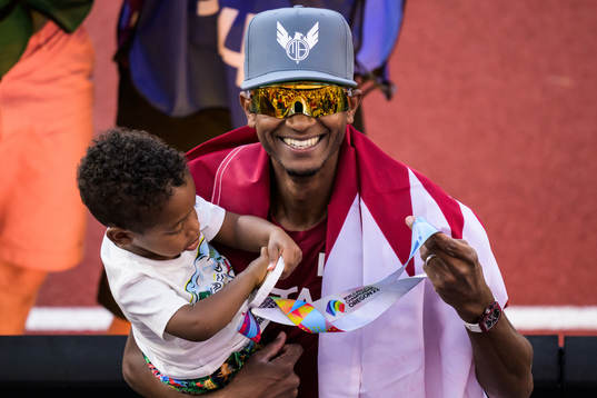 Mutaz Essa Barshim of Qatar celebrates together with his
