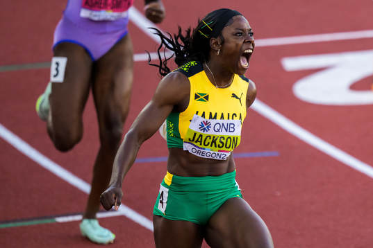 Shericka Jackson of Jamaica celebrates as she wins