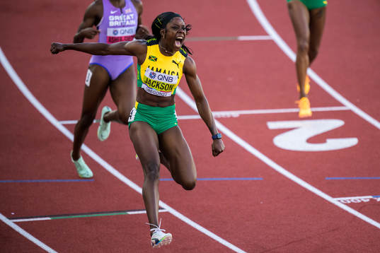 Shericka Jackson of Jamaica celebrates as she wins
