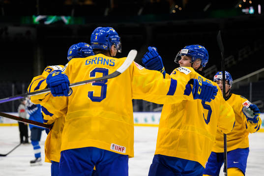 Helge Grans and Anton Olsson of Sweden celebrate the 0-1