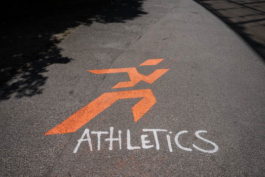 The word ”athletics” and a painting is seen