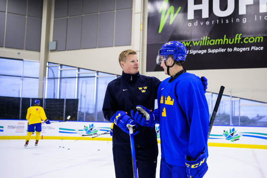 Assistant coach Patrik Andersson and Daniel Ljungman of