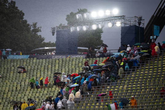 Spectators leaves the stadium due to heavy rain
