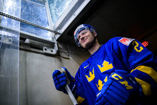 Oskar Magnusson of Sweden walks out to the ice for warm-up