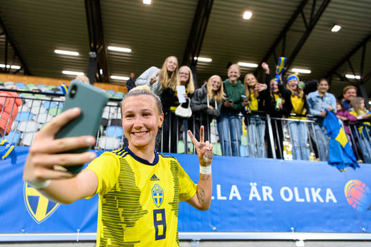 Marika Bergman Lundin of Sweden takes pictures with the