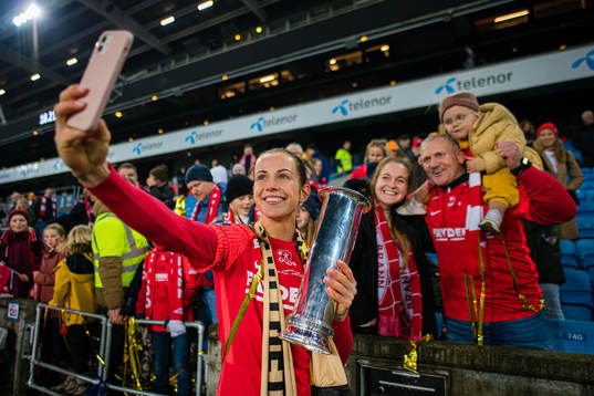 Tuva Hansen of Brann celebrates with the trophy