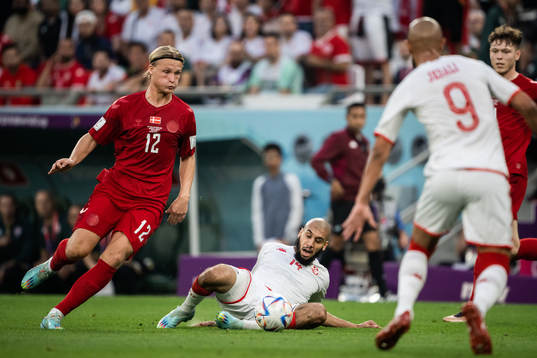 Kasper Dolberg of Denmark and Aissa Laidouni of Tunisia
