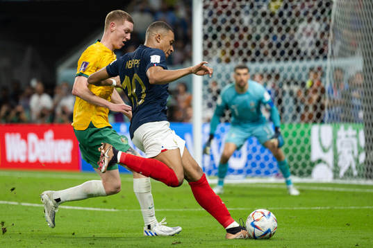 Kye Rowles of Australia and Kylian Mbappe of France