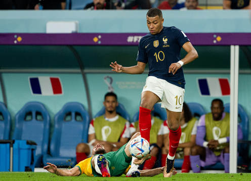 Milos Degenek of Australia and Kylian Mbappe of France