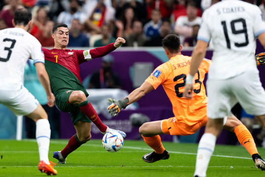 Cristiano Ronaldo of Portugal and goalkeeper Sergio Rochet