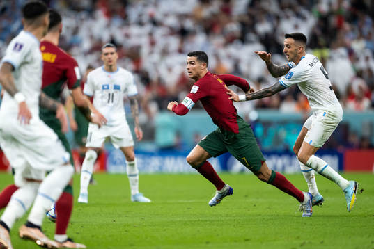 Cristiano Ronaldo of Portugal and Matias Vecino of Uruguay