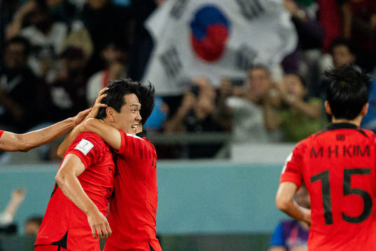 Younggwon Kim and Inbeom Hwang of South Korea celebrate the