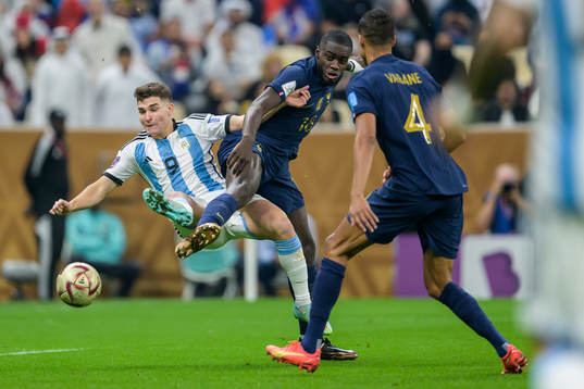 Julian Alvarez of Argentina and Dayot Upamecano of France