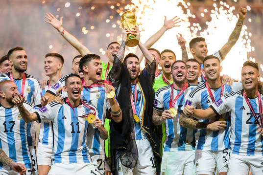 Lionel Messi and players of Argentina celebrate with the