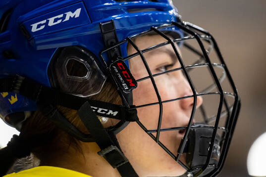 A player of Sweden with a helmet at a practice session