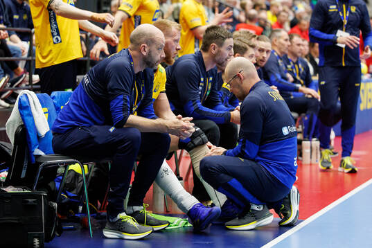 Jim Gottfridsson of Sweden receives medical attention