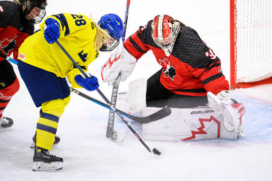 Moa Gustafsson of Sweden against goaltender Hannah Clark of