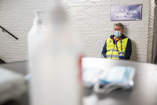 A volunteer with a face mask