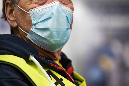 A volunteer with a face mask