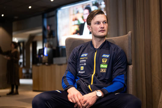 Jonathan Carlsbogård is interviewed at a press event with