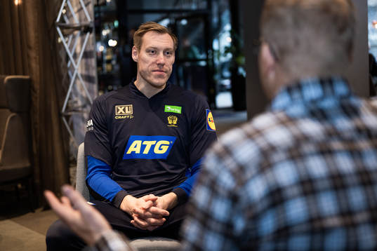 Fredric Pettersson is interviewed at a press event with