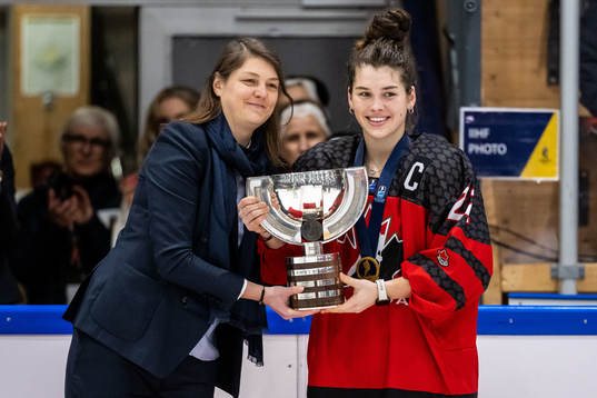 Jocelyn Amos of Canada receives the first place trophy
