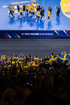 Players of Sweden recognizes the audience as they celebrate