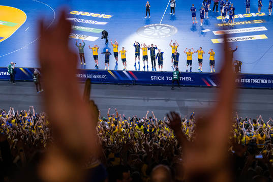 Players of Sweden recognizes the audience as they celebrate