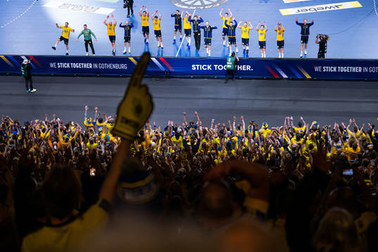 Players of Sweden recognizes the audience as they celebrate