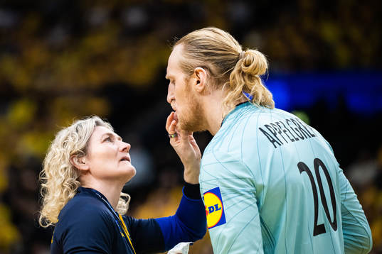 Mikael Appelgren of Sweden receives medical attention