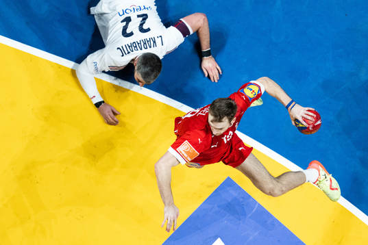 Luka Karabatic of France and Mathias Gidsel of Denmark